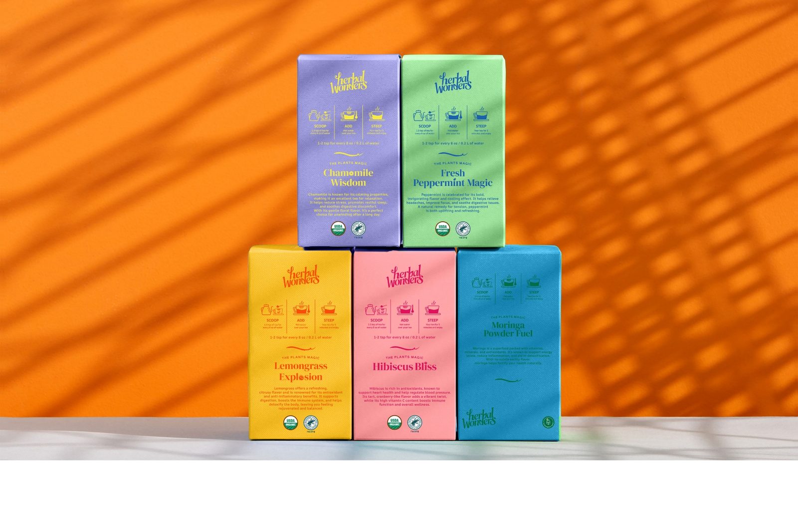 Herbal Wonders tea boxes stacked in a pyramid